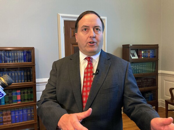 FILE - Missouri Secretary of State Jay Ashcroft speaks to reporters on June 29, 2022, at his Capitol office in Jefferson City, Mo. Disagreements over abortion rights, gun control and treatment of racial minorities are just some of the issues that have caused several political leaders to say they can’t take an oath or recite the Pledge of Allegiance. Some Republicans, including Ashcroft, a candidate for governor in Missouri, point to amendments enshrining abortion rights in state constitutions. (AP Photo/David A. Lieb, File)