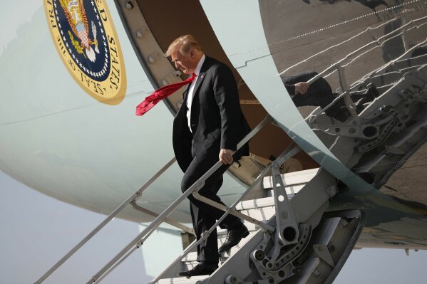 
              President Donald Trump walks down the stairs of Air Force One during his arrival at Palm Beach International Airport, in West Palm Beach, Fla.,Thursday, March 29, 2018. Trump is spending the weekend at his his Mar-a-Lago estate. (AP Photo/Pablo Martinez Monsivais)
            
