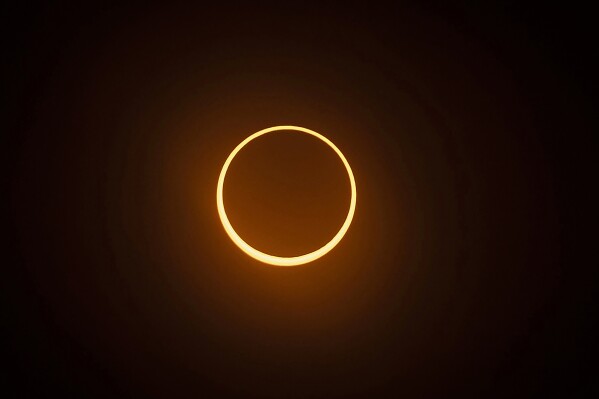 The "ring of fire" annular eclipse during the Albuquerque International Balloon Fiesta in Albuquerque, N.M., on Saturday, Oct. 14, 2023. (Chancey Bush/Albuquerque Journal via AP)