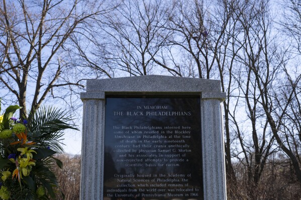 University of Pennsylvania's Penn Museum hosts an interfaith burial service for 19 unidentified Black Philadelphians whose remains were part of the museum's display, at Eden Cemetery on Saturday, Feb. 3, 2024, in Collingdale, Pa. As part of a growing effort among museums to reevaluate the curation of human remains, the Ivy League school laid some of the remains to rest last week. (AP Photo/Joe Lamberti)