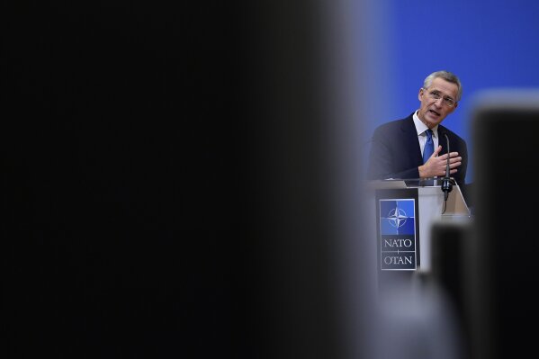 NATO Secretary General Jens Stoltenberg gestures as he addresses a media conference following a virtual meeting of NATO defense ministers at NATO headquarters in Brussels, Wednesday, Feb. 17, 2021. (John Thys, Pool via AP)