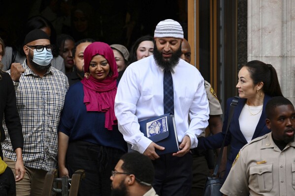 FILE - Adnan Syed, center right, leaves the courthouse after a hearing, Sept. 19, 2022, in Baltimore. The Supreme Court of Maryland announced Wednesday, June 28, 2023, that it will hear appeals from Syed, whose conviction for killing an ex-girlfriend was reinstated by a lower court earlier this year after he was released from prison. The court also said it will hear appeals from the victim's family. (Jerry Jackson/The Baltimore Sun via AP, File)