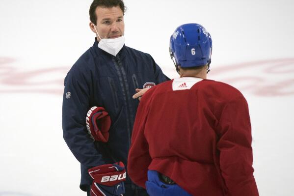 FILE- Montreal Canadiens interim head coach Luke Richardson, left, talks with captain Shea Weber during NHL hockey practice in Brossard, Quebec, on June 27, 2021. The Canadiens take on the Tampa Bay Lightning in the NHL hockey Stanley Cup finals beginning Monday in Tampa, Fla. The Chicago Blackhawks are nearing a deal with Richardson to become their next coach, according to a person familiar with the talks who spoke to The Associated Press on Friday, June 24, 2022, on condition of anonymity because the deal had not been completed. (Graham Hughes/The Canadian Press via AP)