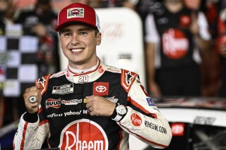 Driver Christopher Bell celebrates in Victory Lane after winning a NASCAR Cup Series auto race at Charlotte Motor Speedway, Sunday, May 26, 2024, in Concord, N.C. (AP Photo/Matt Kelley)