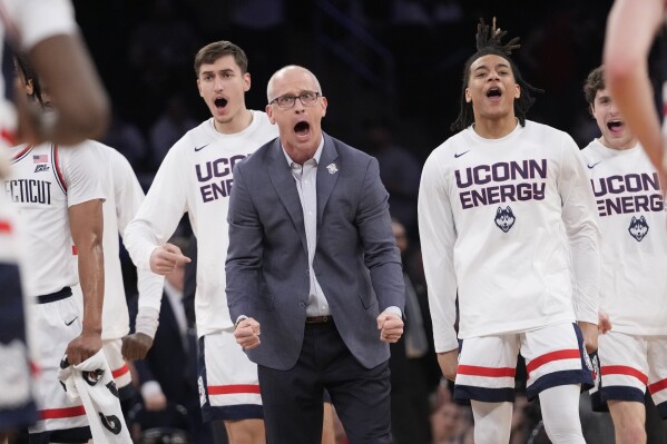 UConn coach Dan Hurley and players react during the first half of the tema's NCAA college basketball game against St. John's in the semifinals of the Big East men's tournament Friday, March 15, 2024, in New York. (AP Photo/Mary Altaffer)