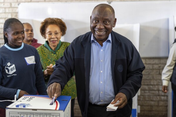 South African President Cyril Ramaphosa casts his ballot Wednesday May 29, 2024 for the general elections in Soweto, South Africa. South Africans are voting in an election seen as their country's most important in 30 years, and one that could put them in unknown territory in the short history of their democracy, the three-decade dominance of the African National Congress party being the target of a new generation of discontent in a country of 62 million people — half of whom are estimated to be living in poverty. (AP Photo/Jerome Delay)