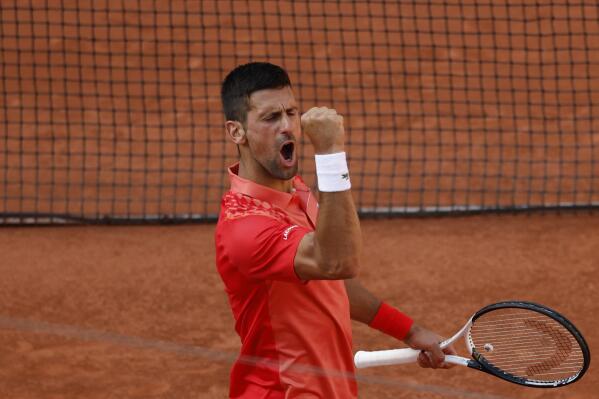 Djokovic - half volley, Novak Djokovic stretching to hit a …