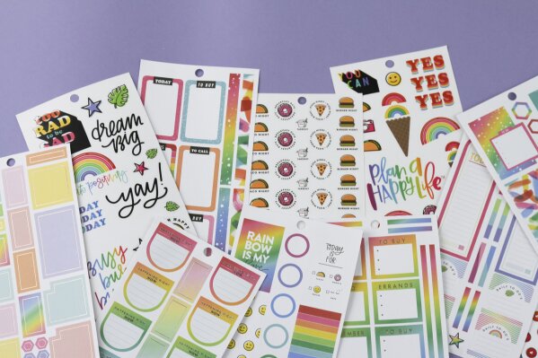 This photo provided by The Happy Planner shows a collection of planner stickers the company has available in 2020. It's a digital and increasingly paperless age. But fans of paper planners remain as enthusiastic and steadfast as ever. (The Happy Planner via AP)
