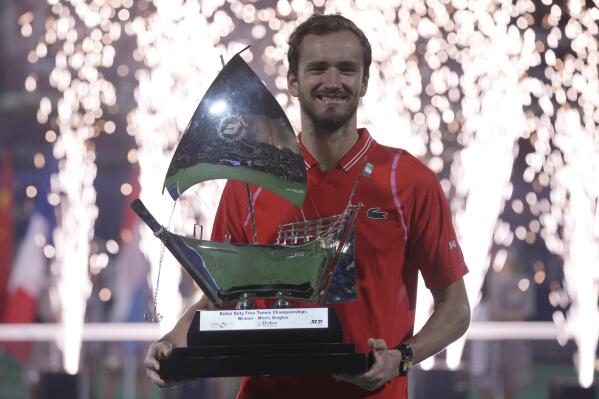 Daniil Medvedev of Russia holds the trophy after defeating Andrey Rublev of Russia during the men's singles final at the Dubai Duty Free Tennis Championships in Dubai, United Arab Emirates, Saturday, March 4, 2023. (AP Photo/Kamran Jebreili)