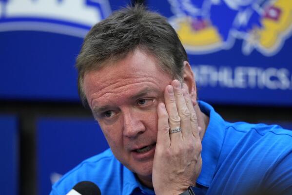 Kansas head coach Bill Self talks to the media after an exhibition NCAA college basketball game Thursday, Nov. 3, 2022, in Lawrence, Kan. Self and assistant Kurtis Townsend on Wednesday were suspended for the first four games of the season as part of the fallout from an 2017 FBI investigation into college basketball corruption. (AP Photo/Charlie Riedel)