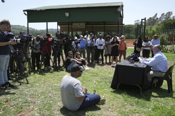 Rob Mathews, the Steenkamp family representative, reads the witness impact statement submitted to the parole body looking into the possible release of Oscar Pistorius, outside the Atteridgeville Prison, in Pretoria, South Africa, Friday, Nov. 24, 2023. (AP Photo/ Tsvangirayi Mukwazhi)