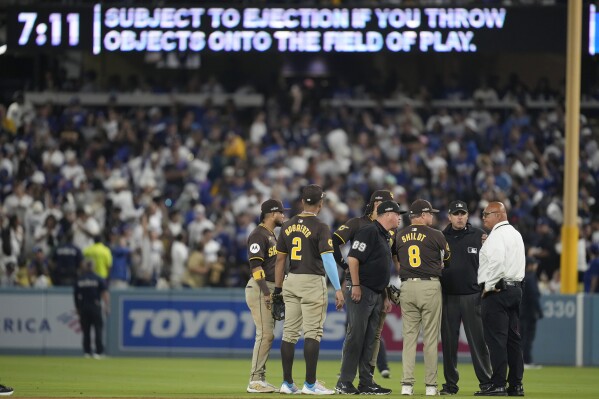 MLB: Fans toss balls and trash on field as Padres beat Dodgers10-2 | AP News