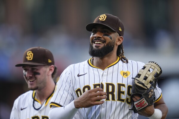 Star right fielder Fernando Tatis Jr. is back with the Padres as they push  for a playoff spot | AP News