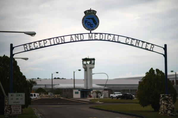 A guard tower stands behind the entrance to the Reception and Medical Center, the state's prison hospital where new inmates are processed, in Lake Butler, Fla., Friday, April 16, 2021. In 2013, at a prison dorm room in the facility, Warren Williams, a Black inmate who suffered from severe anxiety and depression, found himself in front of Thomas Driver, a white prison guard, after he lost his identification badge, a prison infraction. (AP Photo/David Goldman)