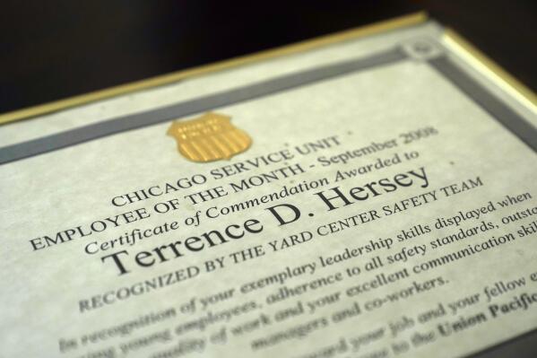 Terrence Hersey's Union Pacific Railroad September 2008 employee of the month certificate sits framed at his home Friday, June 17, 2022, in South Holland, Ill. Hersey underwent extensive rehabilitation for a stroke in 2015, before his doctors eventually cleared him to return to work in 2016. But Union Pacific decided without ever having a doctor examine him that the stroke made him unfit to work for the railroad. Union Pacific has already lost three lawsuits over the way it dismisses employees with health conditions because of safety concerns, and the prospect of hundreds more similar lawsuits, including Hersey's case, looms over the railroad. (AP Photo/Charles Rex Arbogast)