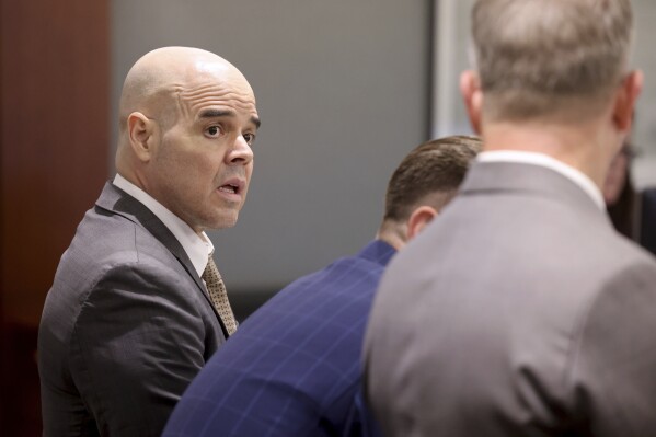 Robert Telles, left, talks with his attorneys Robert Draskovich, right, and Michael Horvath, in court prior to jury selection on the second day of his murder trial at the Regional Justice Center in Las Vegas Tuesday, Aug. 13, 2024. Telles, a former Clark County public administrator, is charged in the murder of Las Vegas Review-Journal investigative journalist Jeff German. (K.M. Cannon/Las Vegas Review-Journal via AP, Pool)