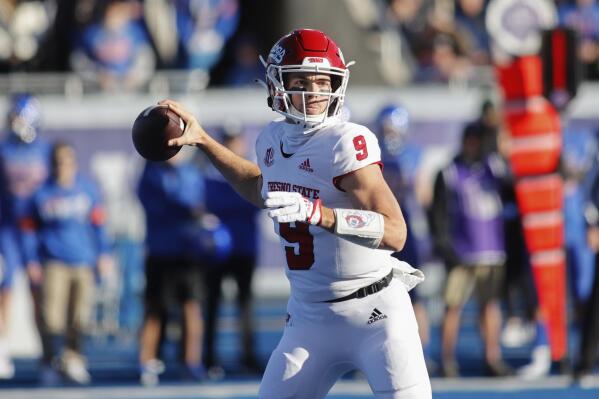 Fresno State quarterback Jake Haener looks to pass the ball against Boise State during the first half of an NCAA college football game for the Mountain West championship, Saturday, Dec. 3, 2022, in Boise, Idaho. (AP Photo/Otto Kitsinger)