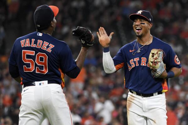 Houston Astros third baseman Robel Garcia, right, celebrates with starting pitcher Framber Valdez after throwing out Chicago White Sox's Adam Engel to end the top of the fifth inning of a baseball game, Saturday, June 19, 2021, in Houston. (AP Photo/Eric Christian Smith)