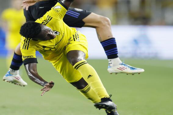 CF Montreal's Gabriele Corbo, top, heads the ball away from Columbus Crew's Derick Etienne during the second half of an MLS soccer match Wednesday, Aug. 3, 2022, in Columbus, Ohio. (AP Photo/Jay LaPrete)