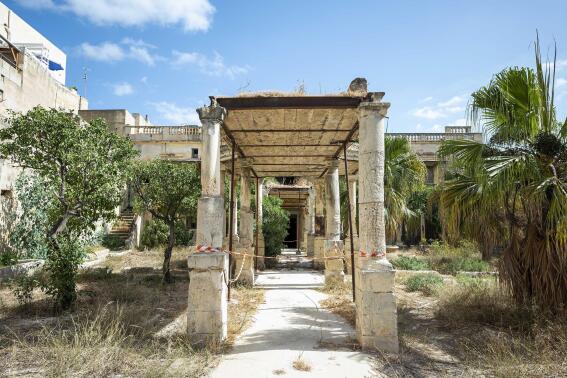 An external view of Villa Guardamangia, Malta, Friday, Sept. 16, 2022, where the newlywed Princess Elizabeth lived for months at a time between 1949-1951. A dilapidated villa outside Malta's capital where a young Princess Elizabeth and her new husband spent some of their happiest days before she became Britain's queen has become the focal point of Malta's remembrance of the late monarch and her special ties to the former British colony in the Mediterranean. (AP Photo/Rene Rossignaud)