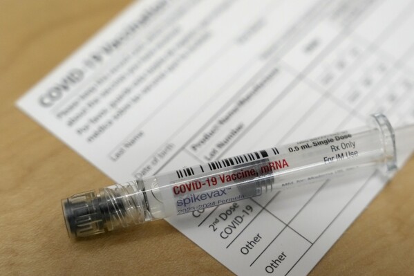 FILE - A Moderna Spikevax COVID-19 vaccine is seen at a pharmacy in Cypress, Texas on Wednesday, Sept. 20, 2023. Fall 2023 vaccination season is in full swing, with health officials in the U.S. urging both an updated COVID-19 shot and flu vaccine for most everyone. New this year are vaccines for older adults and women in late pregnancy to guard against another virus named RSV. (Melissa Phillip/Houston Chronicle via AP, File)