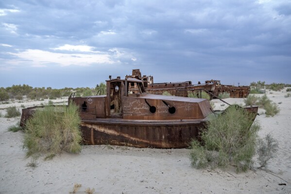Rusting ships sit near a museum outside of Muynak, Uzbekistan, Sunday, June 25, 2023. (AP Photo/Ebrahim Noroozi)