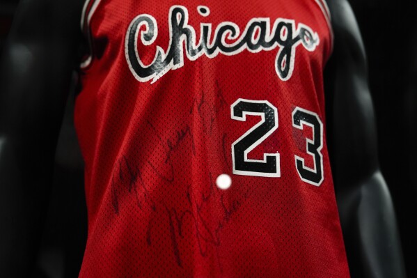Michael Jordan's first game-worn Chicago Bulls jersey is displayed at Sotheby's, Friday, March 21, 2025, in New York, where they are set to be auctioned. (AP Photo/Julia Demaree Nikhinson)
