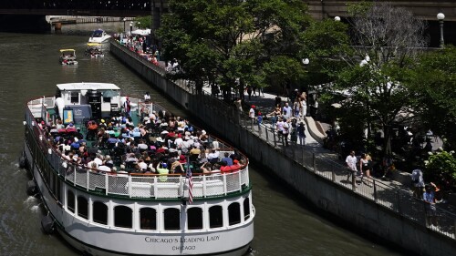 A tour boat is seen on the Chicago River in Chicago, Monday, July 3, 2023, a day after heavy rains flooded Chicago streets and neighborhoods. (AP Photo/Nam Y. Huh)