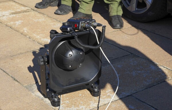 In this photo provided by the Serbian Interior Ministry, Serbian Gendarmerie officers show the U.S.-made Long Range Acoustic Device (LRAD) – which is illegal in Serbia and many other countries, in Belgrade, Serbia, Wednesday, March 19, 2025. (Serbian Ministry of Interior via AP)