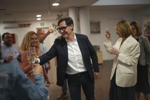 Socialist candidate Salvador Illa makes a toast with members of his team and party colleagues after the announcement of the results of elections to the Catalan parliament in Barcelona, Sunday May 12, 2024. The Socialists led by former health minister Illa won a majority of 42 seats, up from their 33 seats in 2021 when they also barely won the most votes but were unable to form a government. They will still need to earn the backing of other parties to put Illa in charge.(Ǻ Photo/Emilio Morenatti)