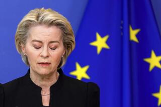 European Commission President Ursula von der Leyen prepares to make a statement, regarding the death of European Parliament President David Sassoli, at EU headquarters in Brussels, Tuesday, Jan. 11, 2022. David Sassoli, the Italian journalist who worked his way up in politics and became president of the European Union's parliament, died at a hospital in Italy early Tuesday, Jan. 11, 2022 his spokesperson said. (AP Photo/Olivier Matthys, Pool)