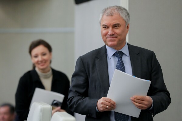 In this photo released by The State Duma, speaker of the State Duma, the Lower House of the Russian Parliament Vyacheslav Volodin, right, arrives to attend a session at the State Duma, in Moscow, Russia, on Wednesday, Nov. 15, 2023. Russia's State Duma passed a record federal budget in its second reading which aims to increase spending by around 25% in 2024, with record amounts going on defense. (The State Duma, the Lower House of the Russian Parliament via AP)