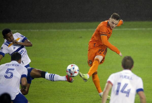 Houston Dynamo FC forward Tyler Pasher (19) shoots the ball against the San Jose Earthquakes during the first half of an MLS soccer game at BBVA Stadium on Friday, April 16, 2021, in Houston. (Godofredo A. Vásquez/Houston Chronicle via AP)