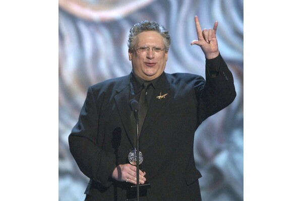 Harvey Fierstein receives the Tony Award for Best Actor in a Musical for "Hairspray" at the 57th Tony Awards held in New York on June 8, 2003. (AP Photo/Richard Drew, File)