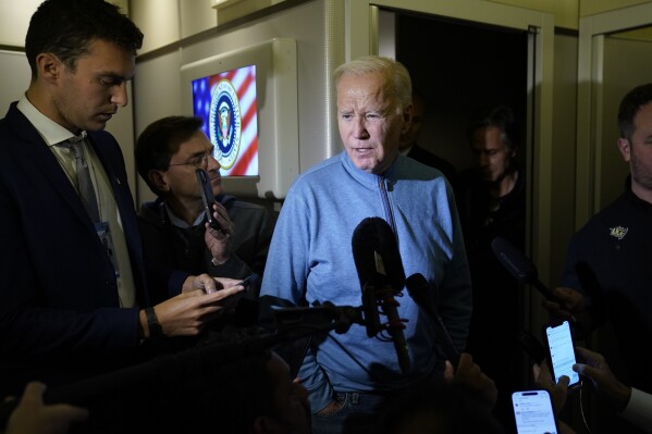 FILE - President Joe Biden talks to reporters aboard Air Force One during a refueling stop in at Ramstein Air Base in Germany Wednesday, Oct. 18, 2023, as he travels back from Israel to Washington. (AP Photo/Evan Vucci, File)