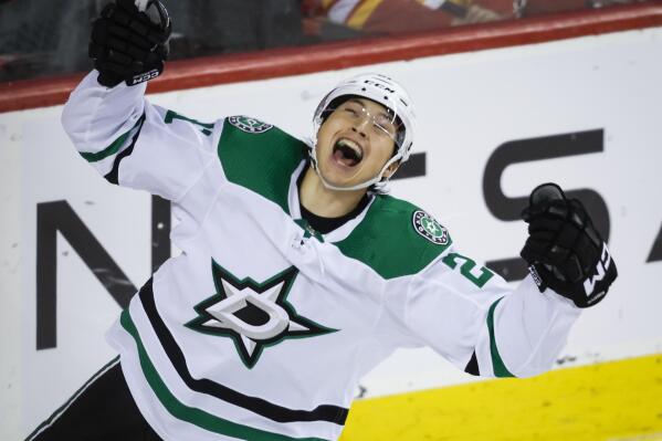 Dallas Stars forward Jason Robertson celebrates his overtime goal against the Calgary Flames during an NHL hockey game Saturday, March 18. 2023, in Calgary, Alberta. (Jeff McIntosh/The Canadian Press via AP)