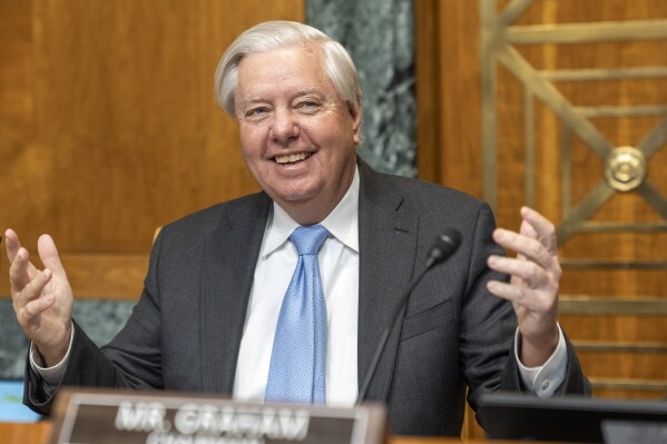 Senate Budget Committee Chair Sen. Lindsey Graham, R-S.C., arrives for a hearing on the nomination of Russell Vought, President Donald Trump's choice for Director of the Office of Management and Budget, on Capitol Hill in Washington, Wednesday, Jan. 22, 2025. (AP Photo/Jacquelyn Martin)