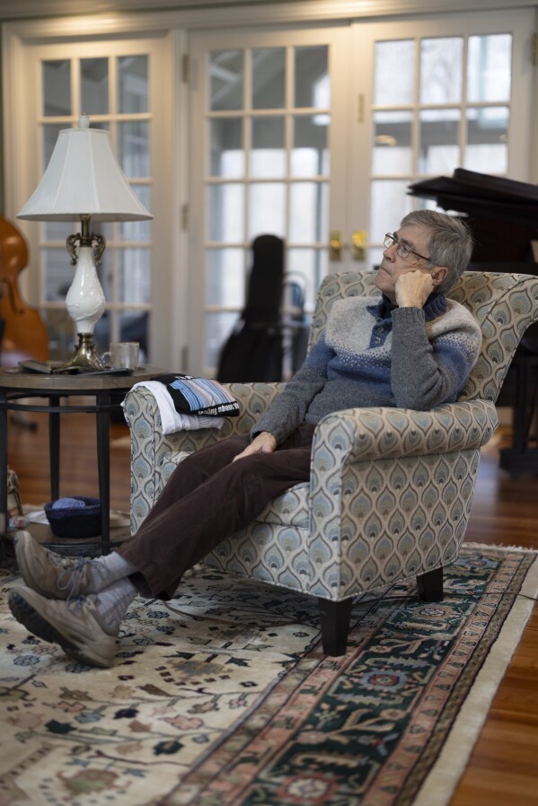 Jon Randall listens during an interview with The Associated Press at his home on Saturday, March 22, 2025, in Webster, N.Y. (Toni Duncan via AP)