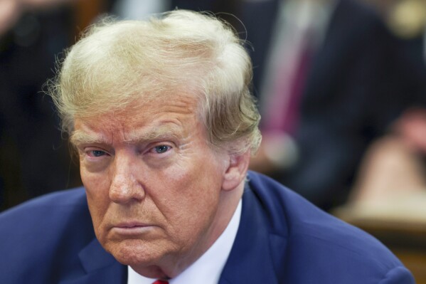 FILE - Former President Donald Trump attends the closing arguments in the Trump Organization civil fraud trial at New York State Supreme Court in the Manhattan borough of New York, Jan. 11, 2024. Trump’s lawyers have asked a New York appellate court to halt collection of the former president’s $454 million civil fraud judgment while he appeals. Trump’s lawyers said in a court filing Wednesday that he is planning to post a $100 million appeal bond rather than a bond covering the full amount, which would automatically pause enforcement. (Shannon Stapleton/Pool Photo via AP, File)