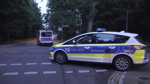 Police patrol during a search operation for a dangerous wild animal near the village of Kleinmachnow in the southern suburbs of Berlin, Germany, Thursday, July 20, 2023. German authorities warned people in Berlin's southern suburbs on Thursday to watch out for a potentially dangerous animal, suspected to be a lioness, that was on the loose. (Sven Kaeuler/TNN/dpa via AP)