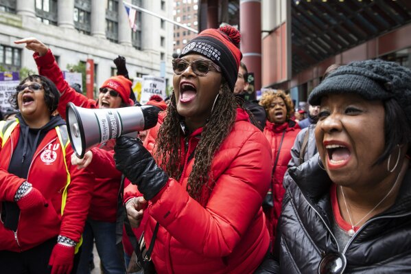 Thousands of striking Chicago Teachers Union and their supporters rally at the Thompson Center after marching  at City Hall during Mayor Lori Lightfoot's first budget address during the monthly Chicago City Council meeting, Wednesday morning, Oct. 23, 2019.  Classes at Chicago Public Schools were canceled for the fifth day on Wednesday as the Chicago Teachers Union and the district remained at odds over teacher pay, class sizes and additional staff for schools. (Ashlee Rezin Garcia/Chicago Sun-Times via AP)