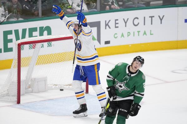 Buffalo Sabres defenseman Owen Power, left, celebrates after scoring in overtime as Dallas Stars left wing Jason Robertson (21) skates away from the net during an NHL hockey game, Monday, Jan. 23, 2023, in Dallas. (AP Photo/Tony Gutierrez)