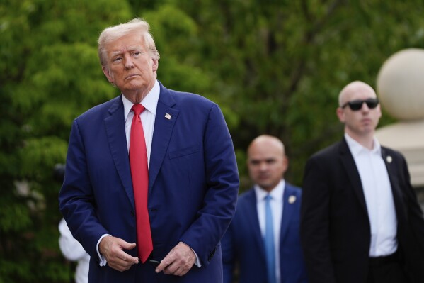 Republican presidential nominee former President Donald Trump walks after a news conference at Trump National Golf Club, Aug. 15, 2024, in Bedminster, N.J. (AP Photo/Julia Nikhinson, File)