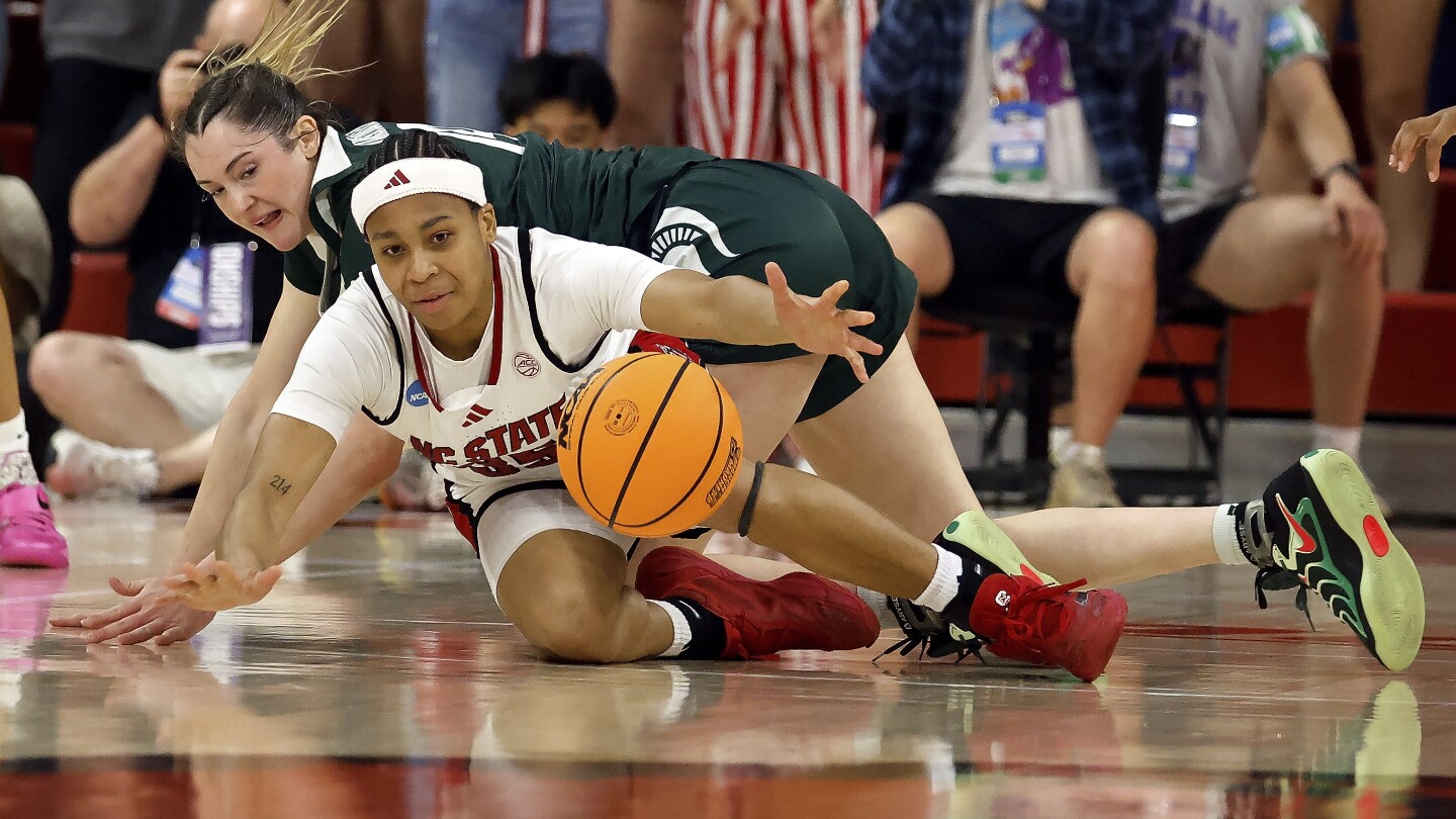 James and Hayes lead N.C. State's 3-point splurge in 83-49 March Madness rout of Michigan State
