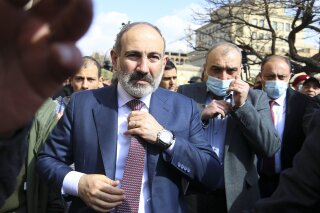 FILE - In this Thursday, Feb. 25, 2021 file photo, Armenian Prime Minister Nikol Pashinyan arrives at the main square in Yerevan, Armenia. Armenia's embattled prime minister has confirmed that he w...