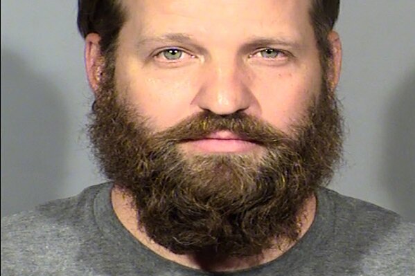 FILE - This undated file booking photo provided by Las Vegas Metropolitan Police Department shows Stephen Parshall. A federal child exploitation charge has been added to conspiracy and firearms counts against Marshall, accused with two other men of plotting terrorism attacks during Las Vegas protests in May. (Las Vegas Metropolitan Police Department via AP, File)