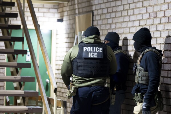 US Immigration and Customs Enforcement Officer is waiting to detain a person in Silver Spring, Maryland on January 27, 2025 (AP Photo/Alex Brandon, File)