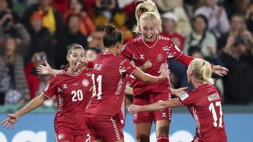Denmark's Amalie Vangsgaard , center, celebrates after scoring the opening goal during the Women's World Cup Group D soccer match between Denmark and China at Perth Rectangular Stadium, in Perth, Australia, Saturday, July 22, 2023. (AP Photo/Gary Day)