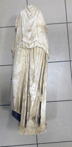 This undated handout photo provided by the Greek Police and released on Wednesday, Jan. 22, 2025 shows a marble statue of a woman believed to be more than 2,000 years old which was found abandoned in a garbage bag in the northern city of Thessaloniki, Greece. (Greek Police via AP)