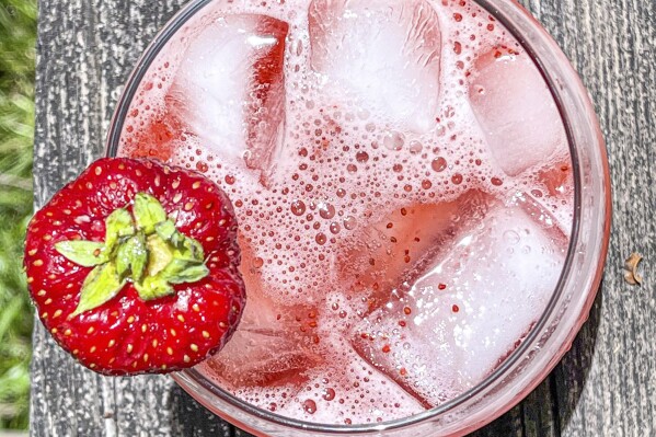 This 2021 image shows a strawberry-basil tonic mocktail. (Suzanne Podhaizer via AP)